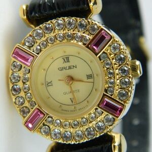 Gruen ladies' quartz watch with a crystal-accented bezel and black leather strap